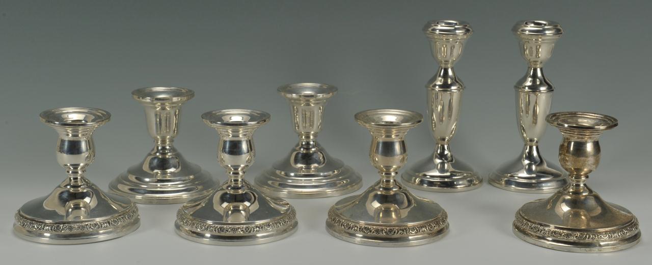 Lot 578: Four pairs sterling silver candlesticks