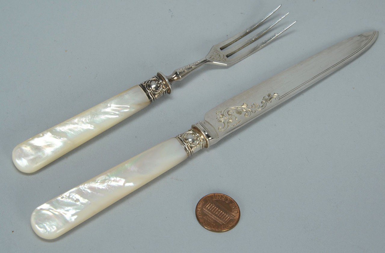 Lot 599: Boxed set s/p and mother of pearl flatware