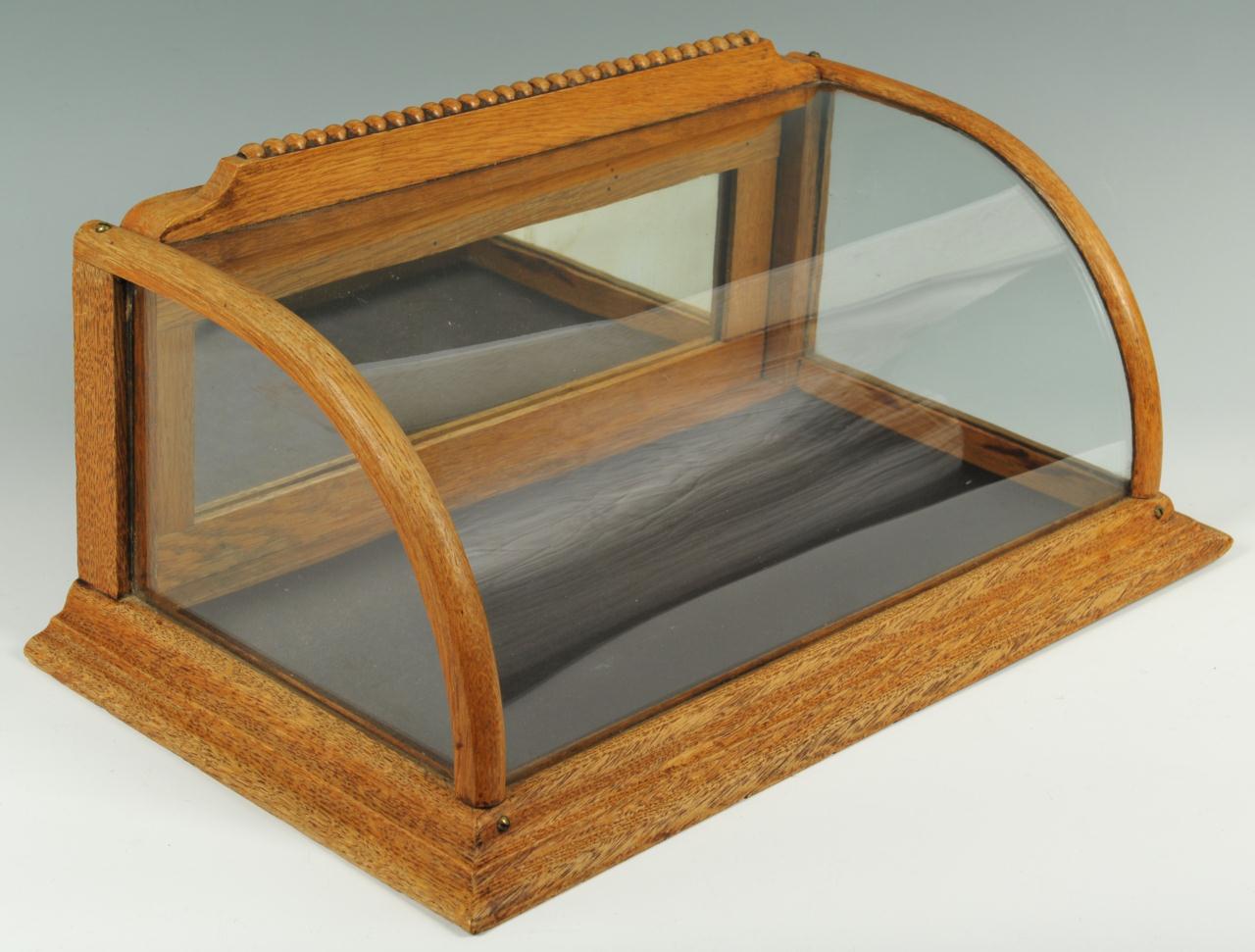 Lot 652: Oak and curved glass countertop display case
