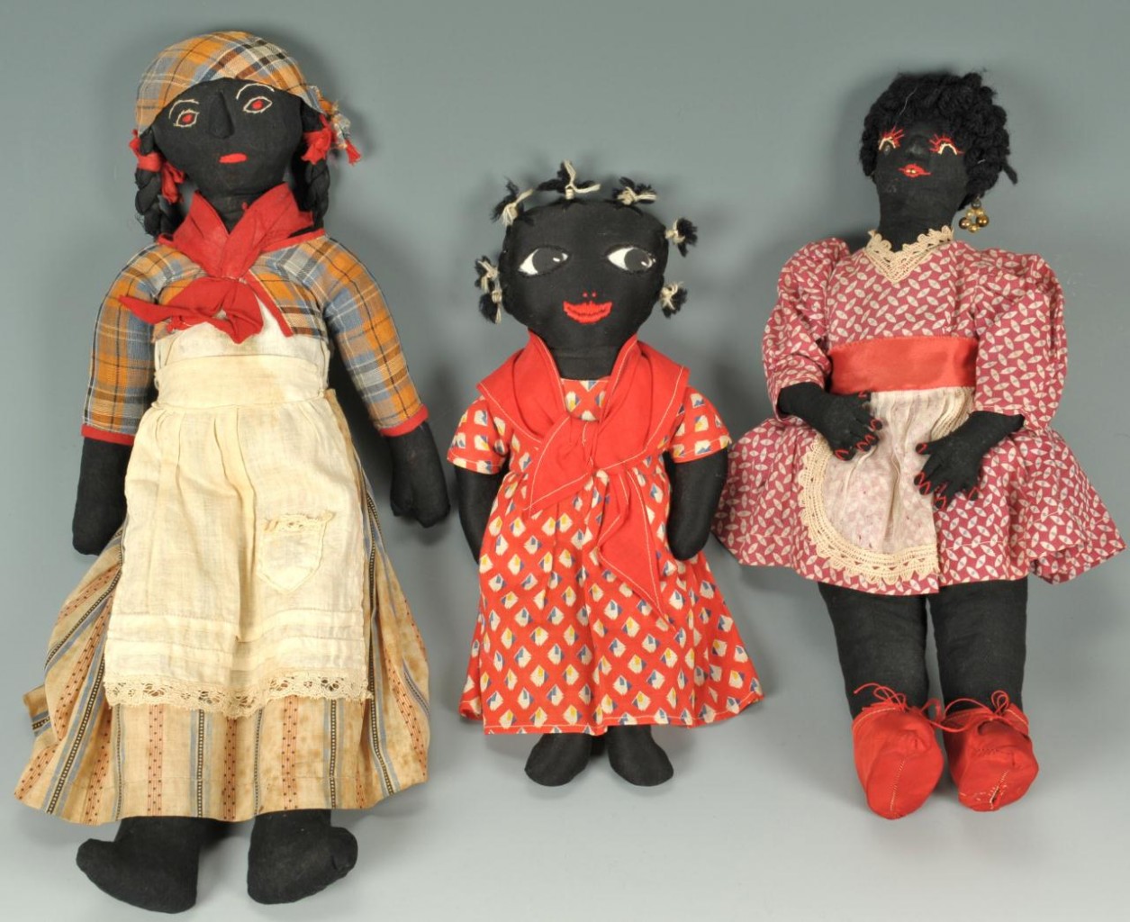 Lot 655: Collection of eleven black dolls