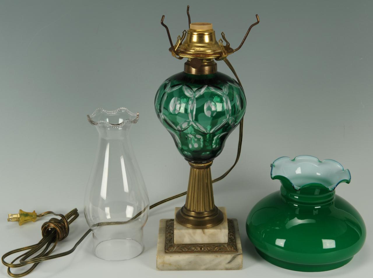 Lot 661: 2 Overlay Cut Glass Oil Lamps