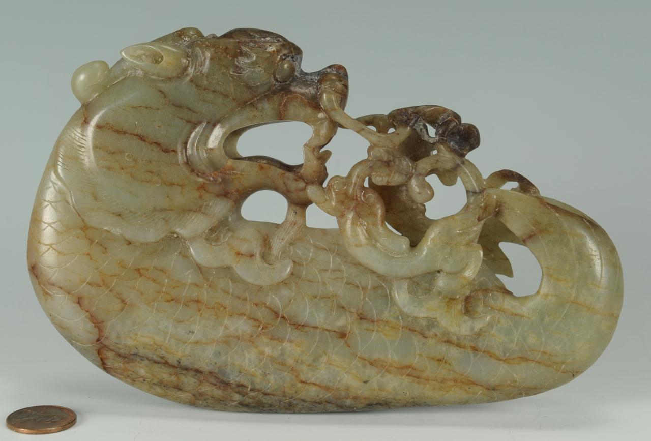 Lot 8: Finely carved Chinese Celadon and Russet jade drag