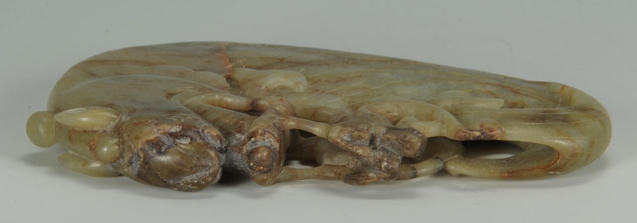 Lot 8: Finely carved Chinese Celadon and Russet jade drag