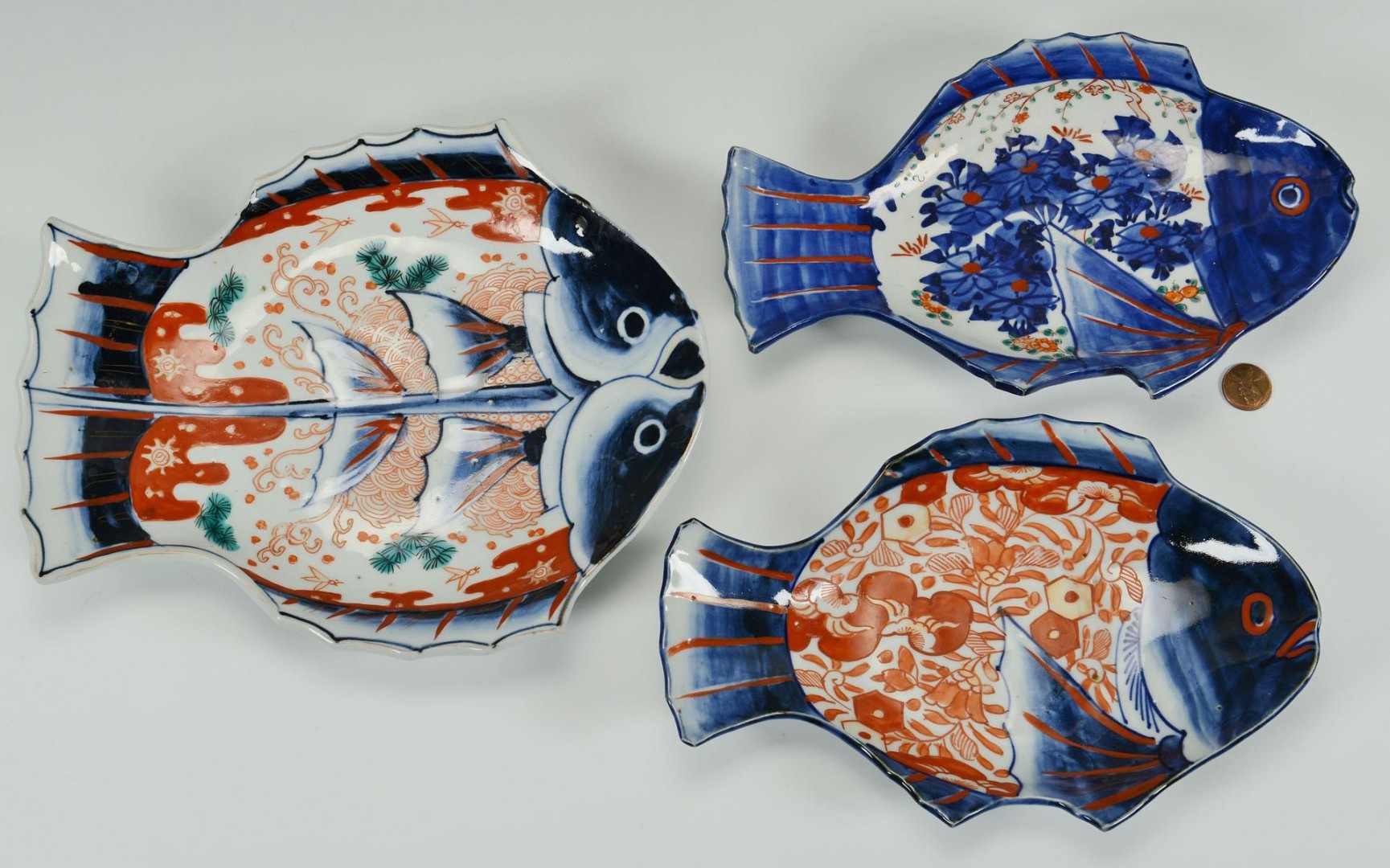 Lot 238: Three Japanese Imari Fish platters, 1 double