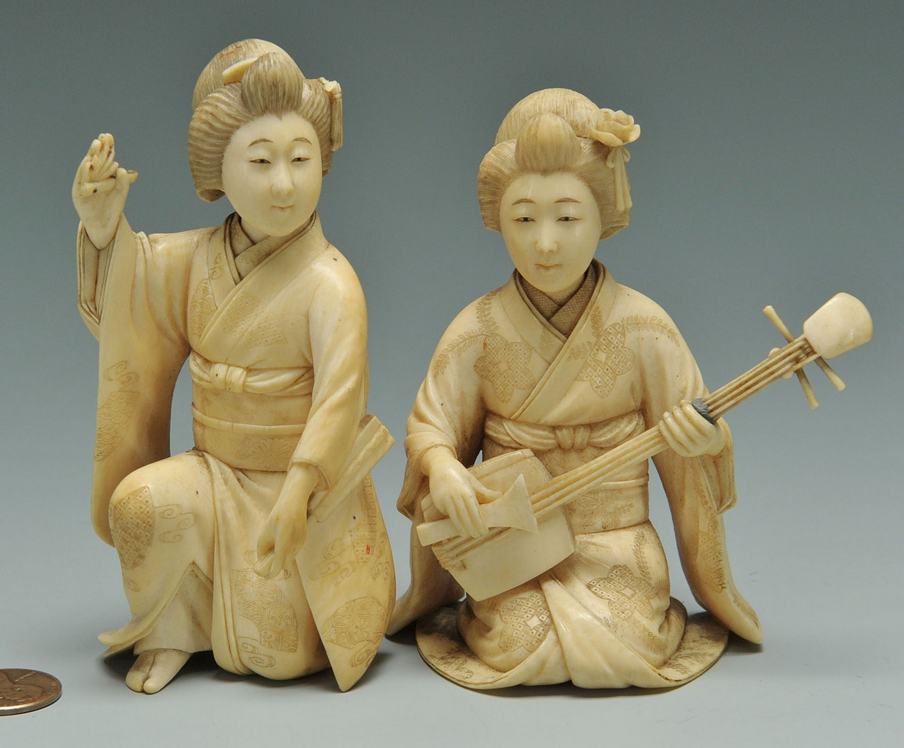 Lot 448: Two Japanese Carved ivory Female Figures