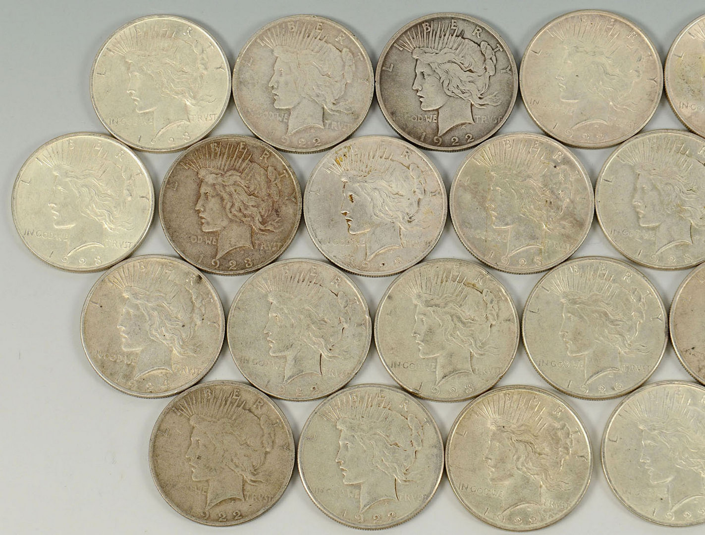 Lot 526: Grouping of 28 Peace Silver Dollars