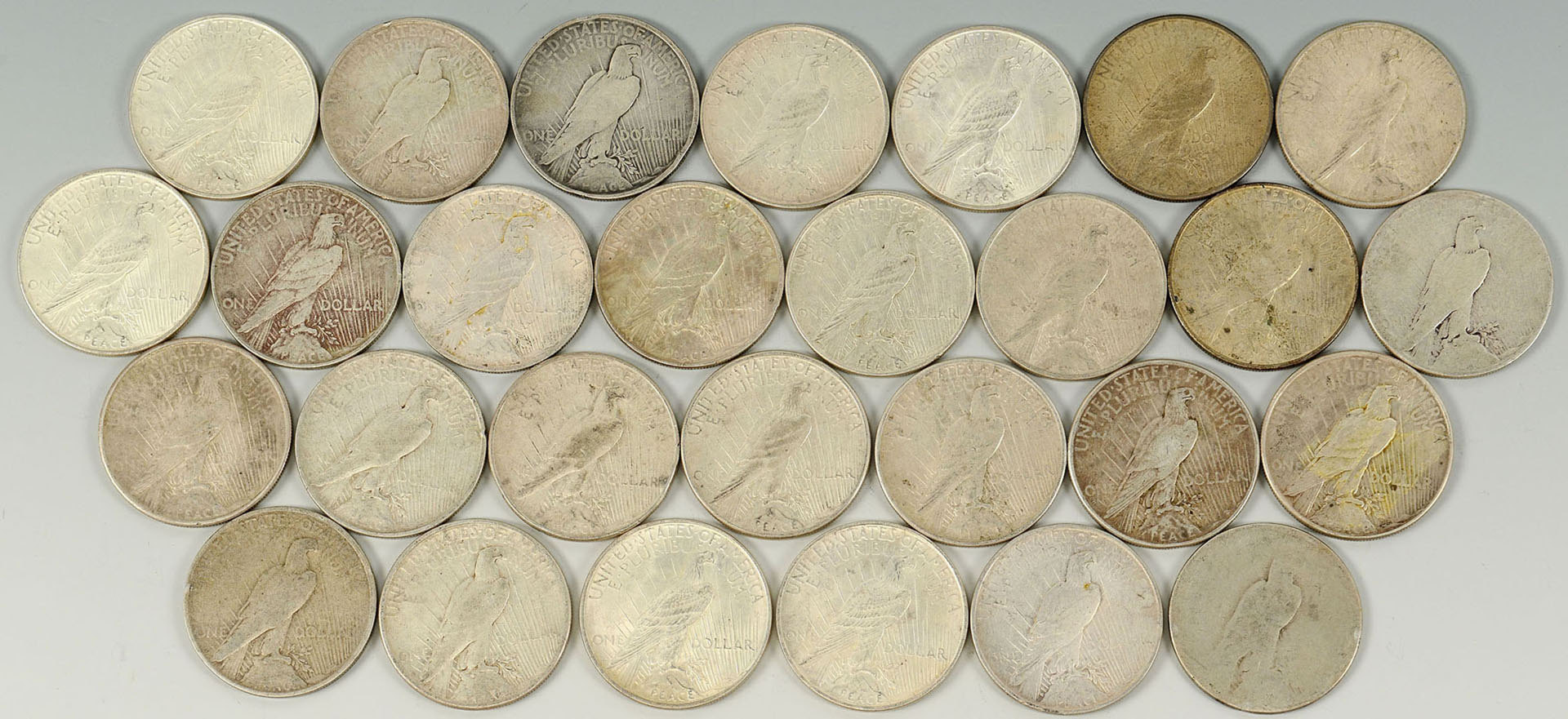 Lot 526: Grouping of 28 Peace Silver Dollars