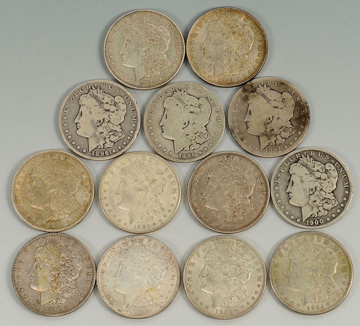 Lot 527: Grouping of 13 Morgan Silver Dollars