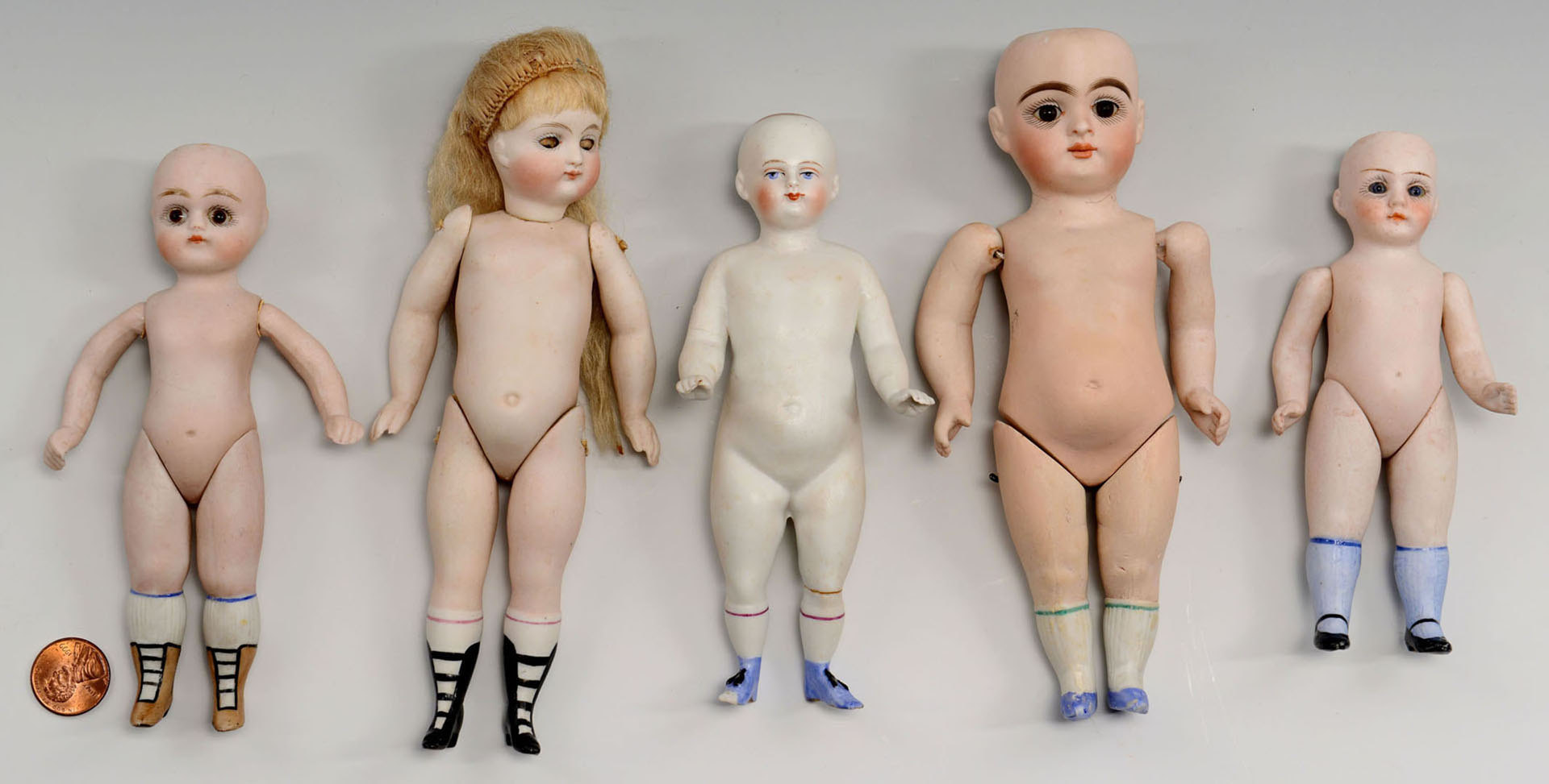 Lot 655: 5 All-Bisque Dolls, mignonette style