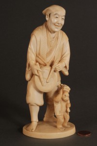 Lot 269: Asian Ivory figure, Musician with Monkey