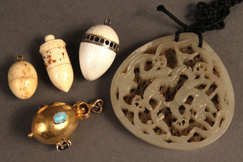 Lot 372: Four pendant charms & a carved jade pendant