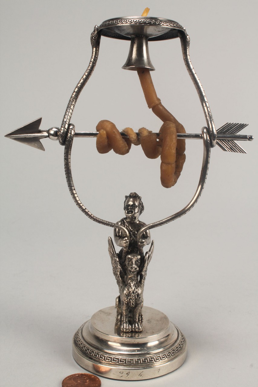 Lot 137: Figural silver wax jack candlestick w/ faun & grif