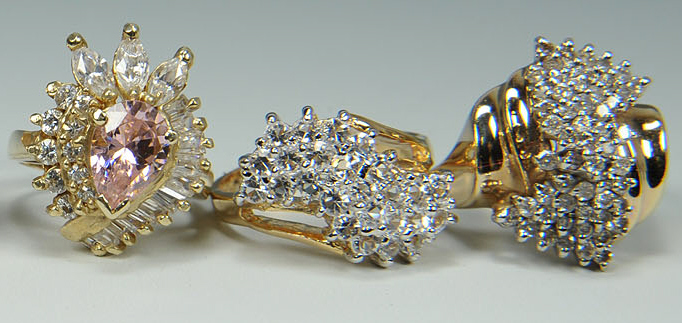 Lot 168: Group of six 10K yellow gold rings, four with diam