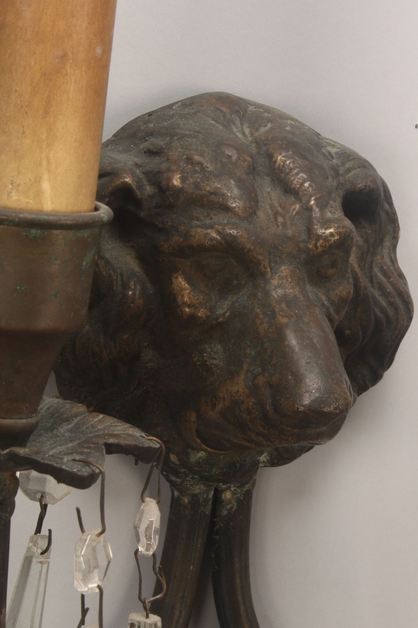 Lot 313: Pair of bronze dog head sconces