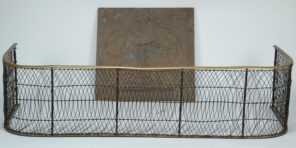 Lot 314: 18th c. Wirework fender & Cast Iron Stove plate