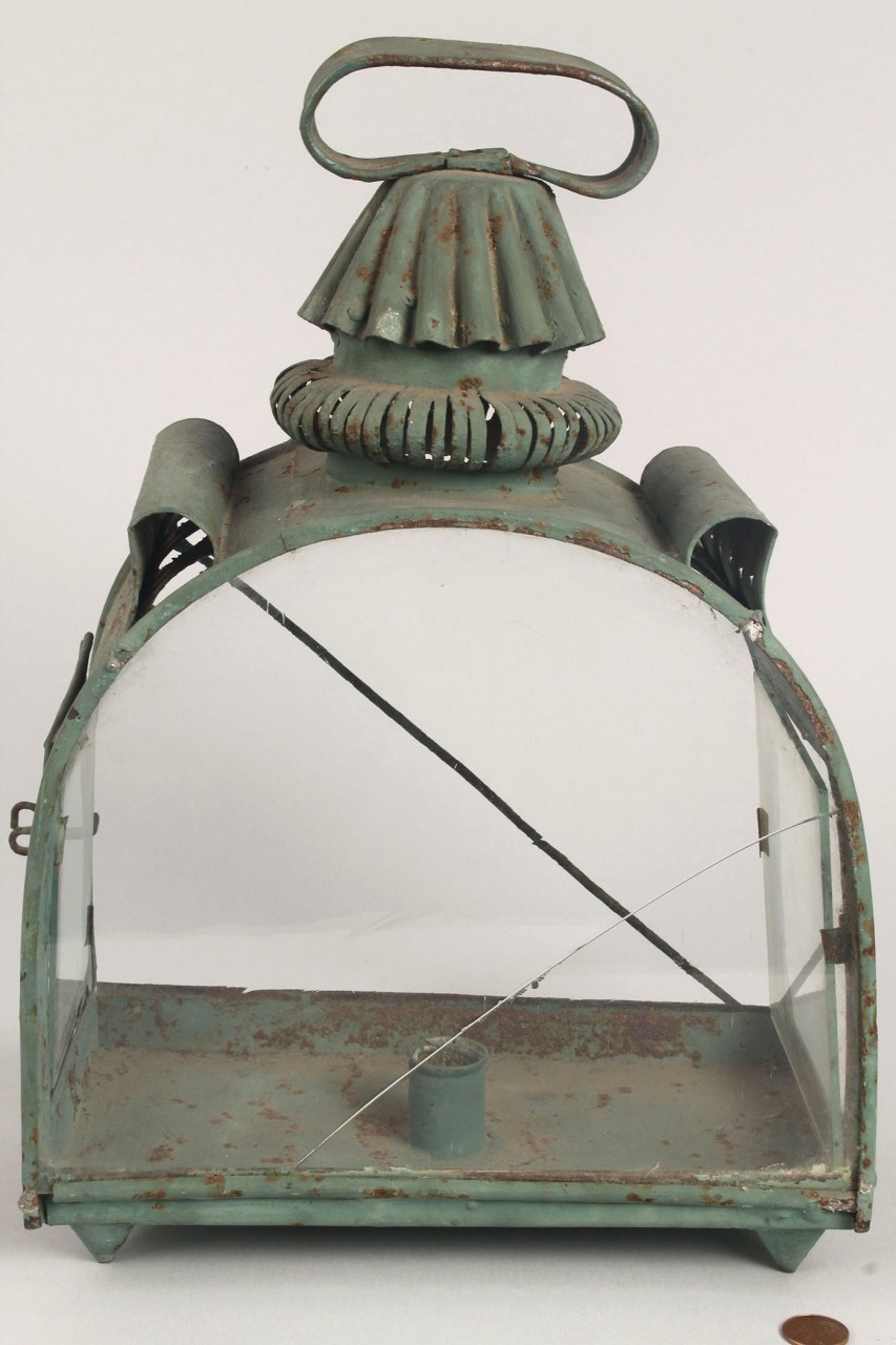Lot 316: Green tin lantern, pierced sun and moon