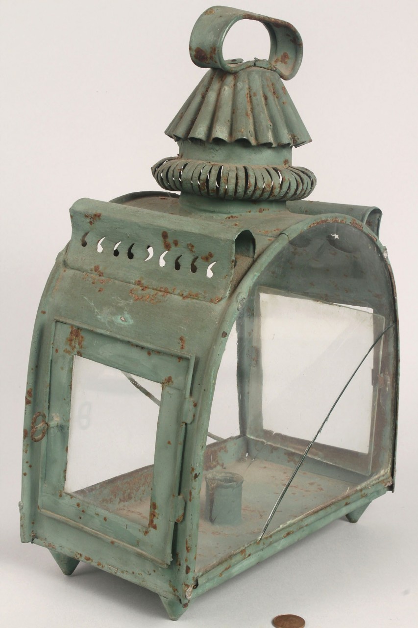 Lot 316: Green tin lantern, pierced sun and moon
