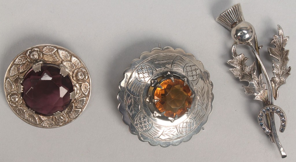 Lot 506: Group of Scottish style jewelry, thistle or stag