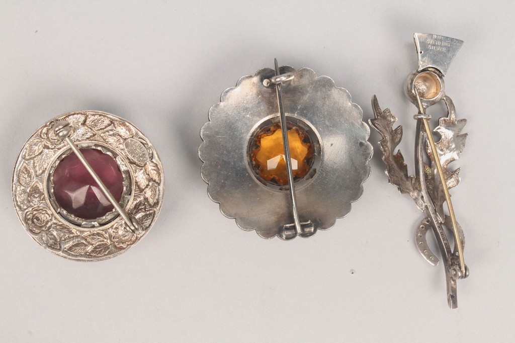 Lot 506: Group of Scottish style jewelry, thistle or stag