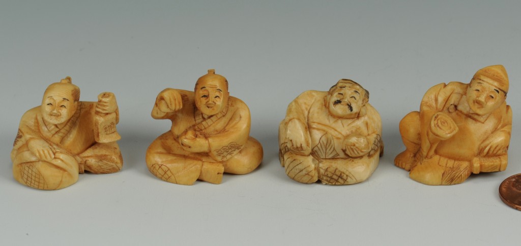 Lot 539: Group of Four stained ivory netsukes