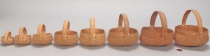Lot 599: 8 Graduated miniature buttocks baskets
