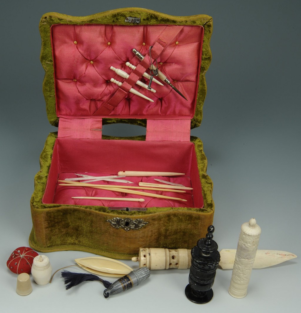 Lot 604: Lot of 22 ivory sewing notions in velvet box