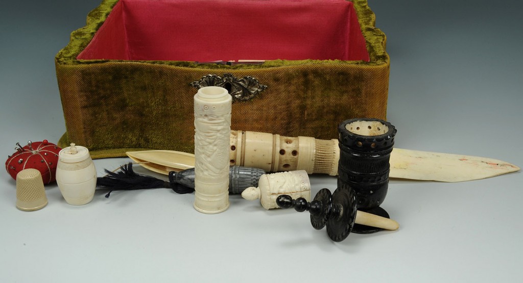 Lot 604: Lot of 22 ivory sewing notions in velvet box