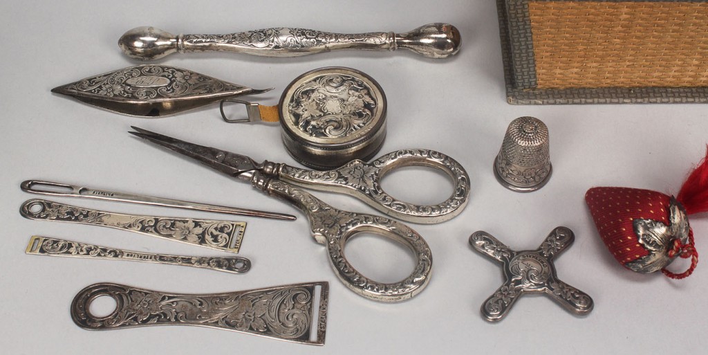 Lot 608: Box of antique sterling silver sewing accessories