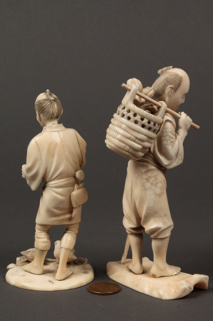Lot 10: Two carved ivory Okimono figures, men with birds and basket