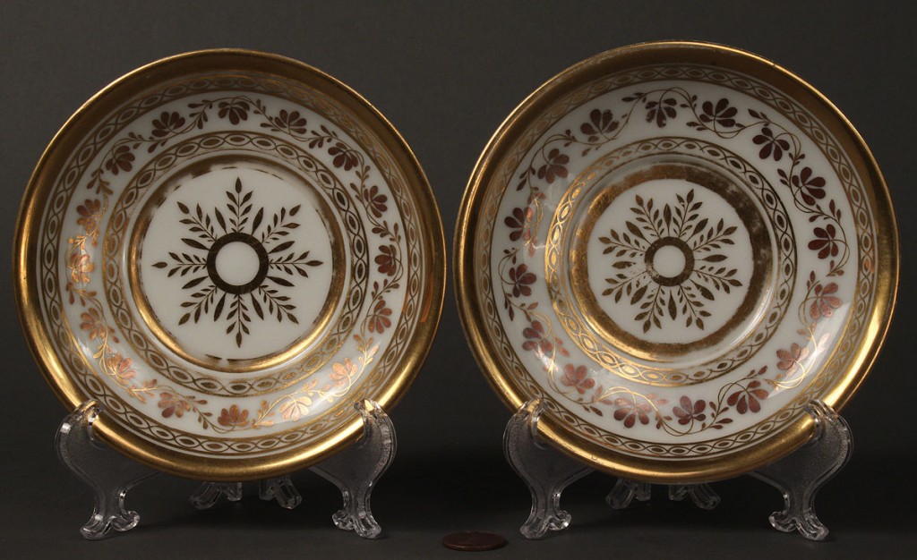 Lot 117: Pair of European figural painted teacups and saucers