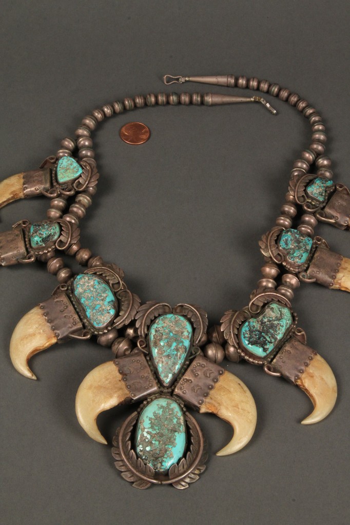 Lot 165: Native American silver and turquoise claw necklace