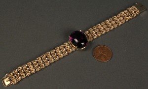 Lot 169: 14K Gold Chain Bracelet w/ purple stone