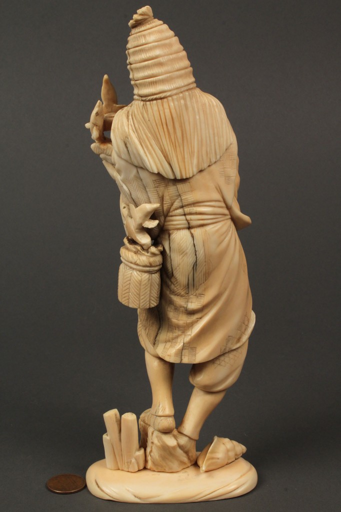 Lot 248: Asian ivory okimono figure, man with eels