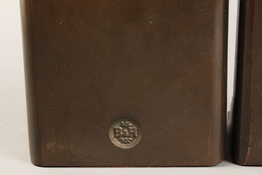 Lot 509: Bronze bookends and doorstop
