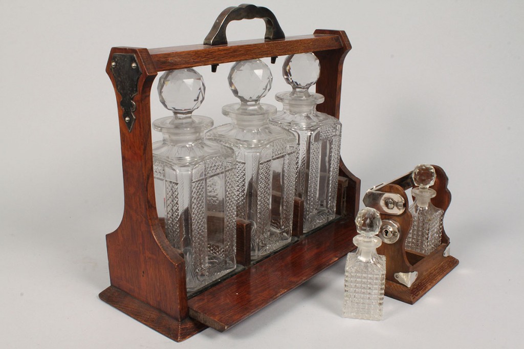 Lot 595:  2 Glass Tantalus Sets, one miniature