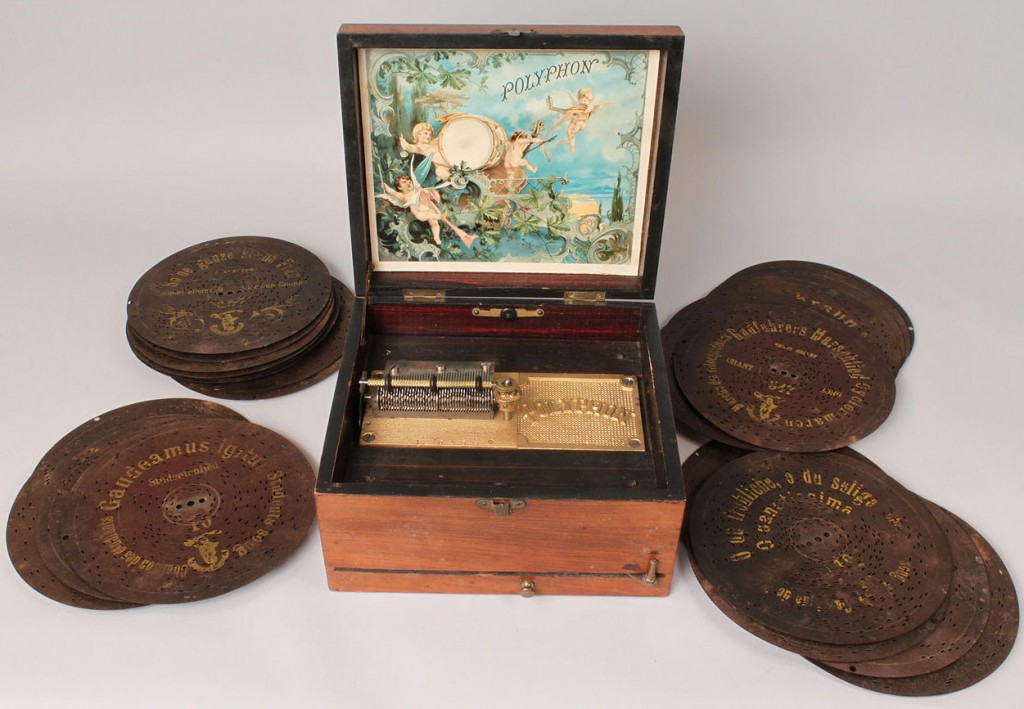 Lot 264: Polyphon wooden music box with discs
