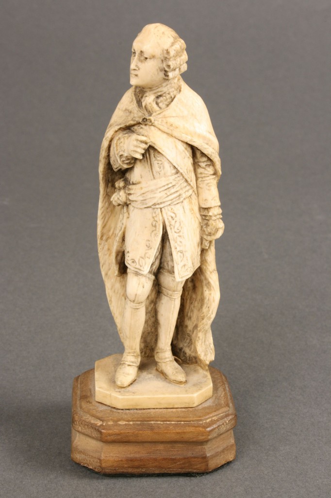 Lot 425: Carved ivory figure of a gentleman
