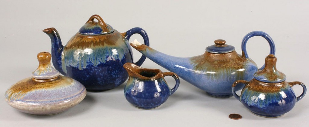 Lot 494: Pigeon Forge blue glazed tea set and 2 oil lamps