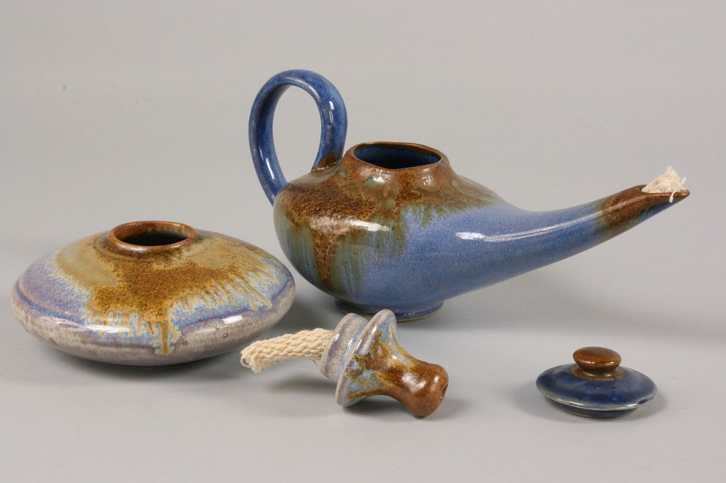 Lot 494: Pigeon Forge blue glazed tea set and 2 oil lamps