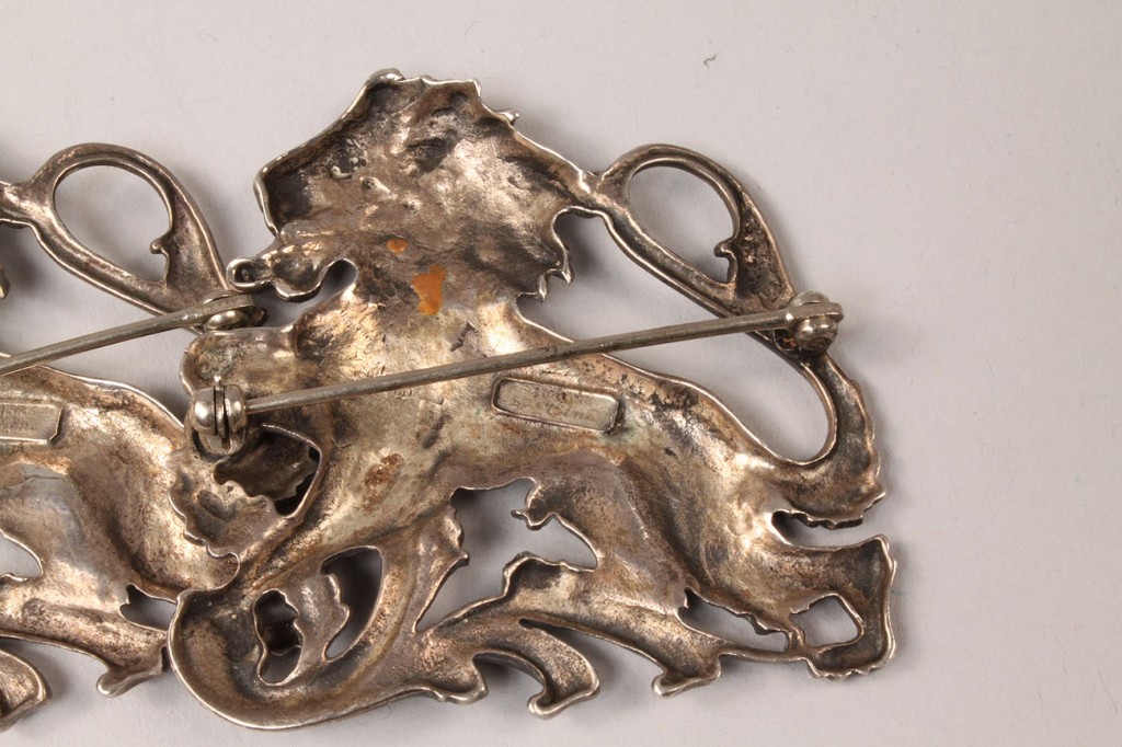 Lot 586: Pair Ciner Sterling Silver Lion Pins