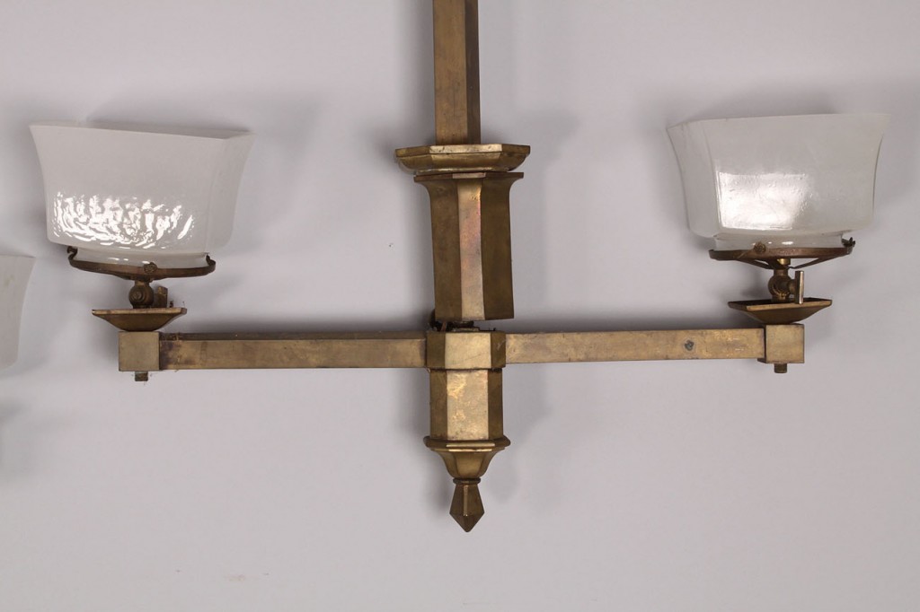 Lot 688: Two brass gasoliers with square glass shades