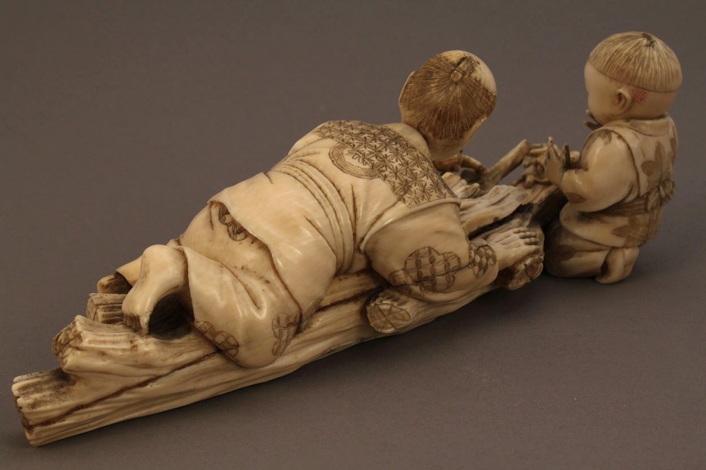 Lot 12: Ivory Okimono figure, boy and father with frogs