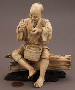 Lot 13: Ivory Okimono figure, man smoking a pipe