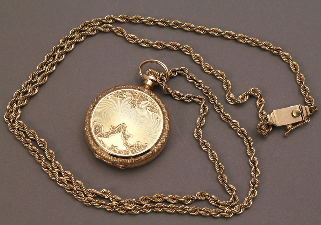 Lot 176: 14K Elgin lady's pendant watch w/ 14K gold chain