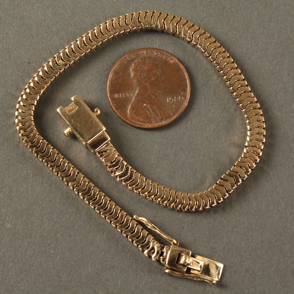 Lot 179: Tiffany 14K serpentine bracelet