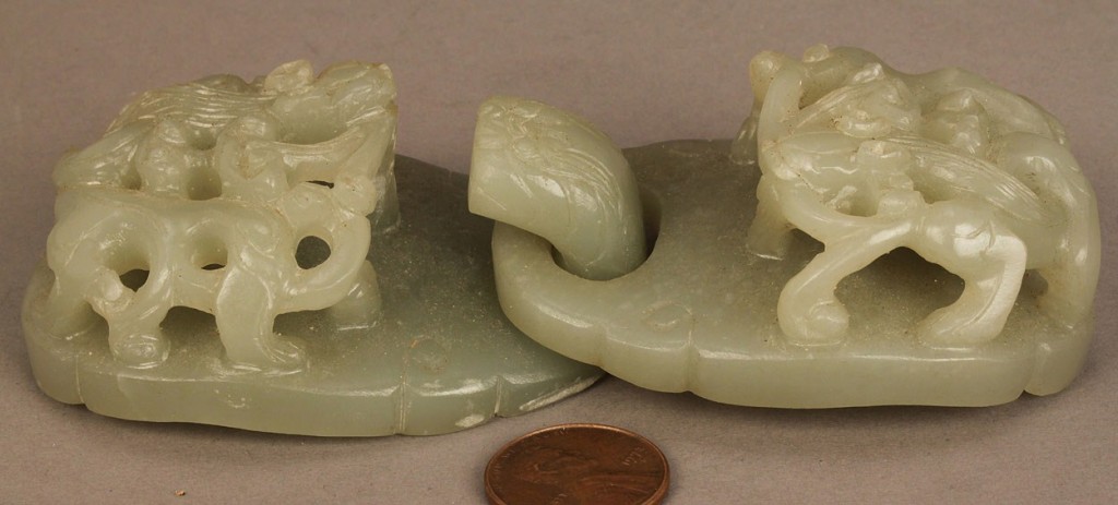 Lot 239: Chinese carved jade buckle and white jade bi disc