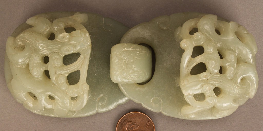Lot 239: Chinese carved jade buckle and white jade bi disc