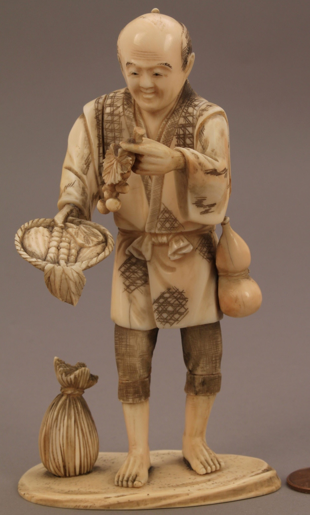 Lot 245: Ivory Okimono figure, Fruit and Vegetable Seller