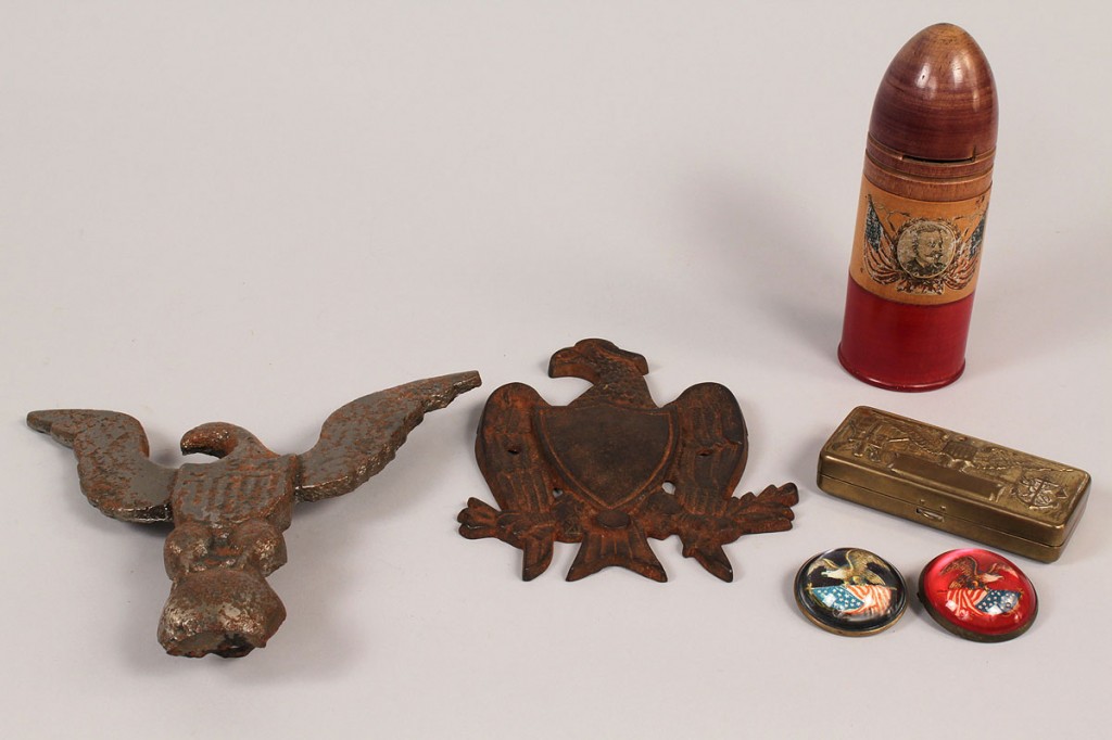 Lot 267: Six patriotic items: iron eagles, pins, bank, and
