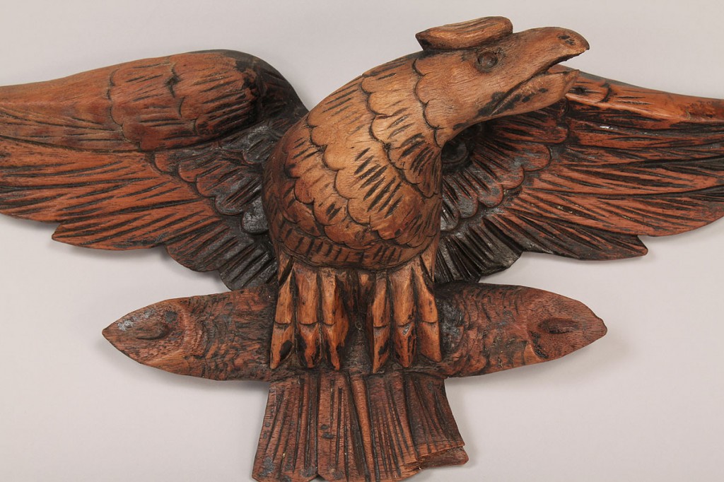 Lot 423: Wooden folk art carved eagle clasping a log